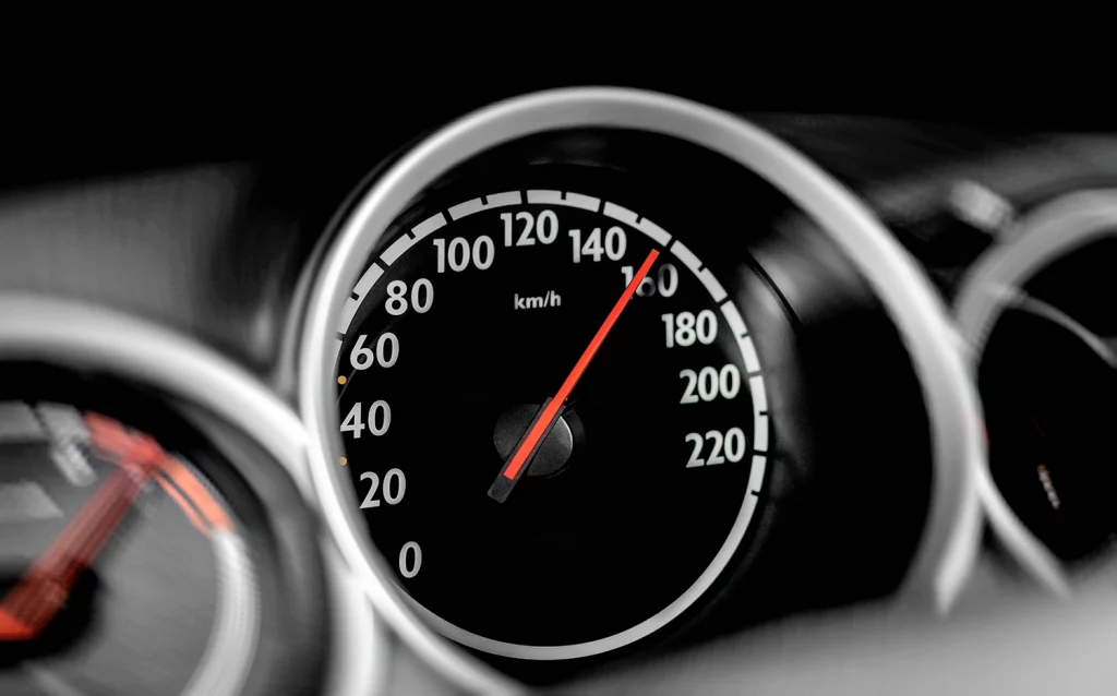 dash speedometer in car showing 150 kmh