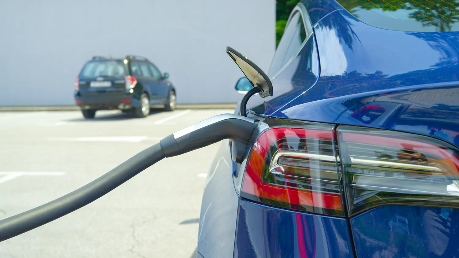 electric charge cable pulgged into ev vehcile