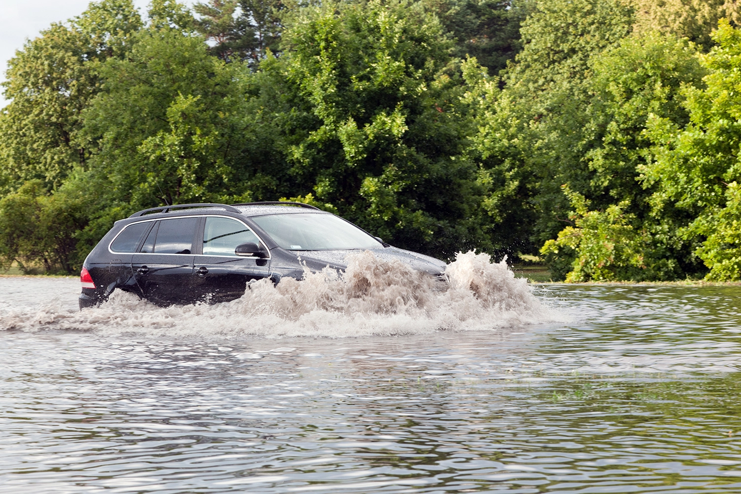 car pushing thru full water above hood