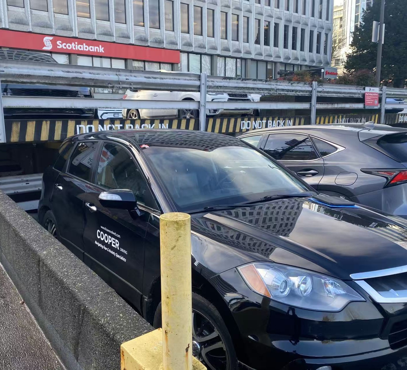 cooper backs in against the signs OPPS!
